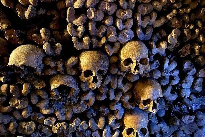 A wall constructed entirely of arranged human skulls and long bones in Capuchin Crypt.