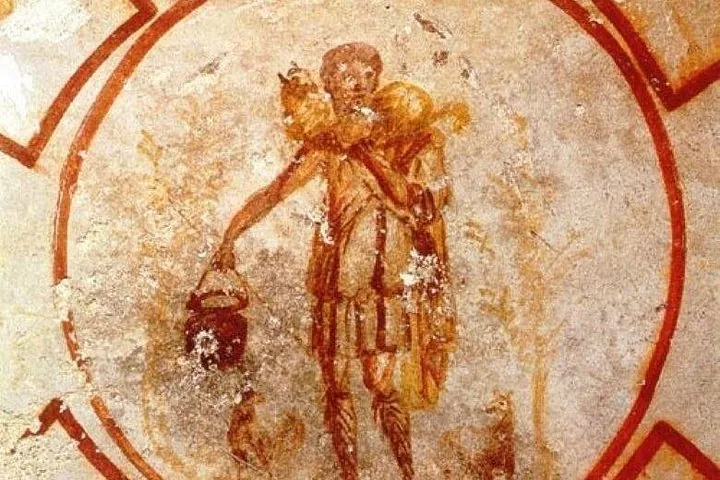 An ancient faded fresco depicting a figure carrying an animal on their shoulders.